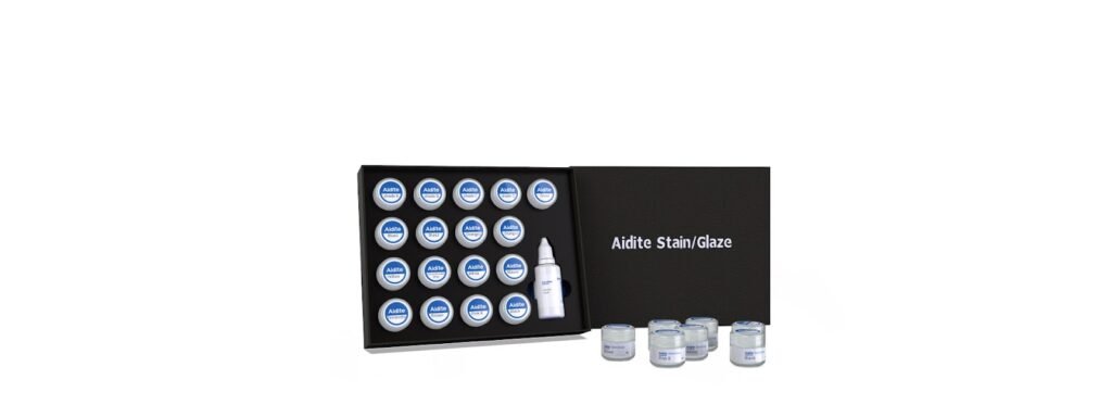 A black box with a set of 15 round containers labeled Aidite