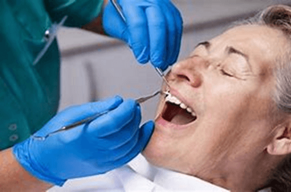 A dentist at work offering periodontal services