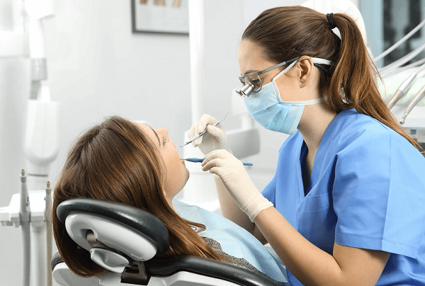 Check Gums, Enamel, and Restorations Closely