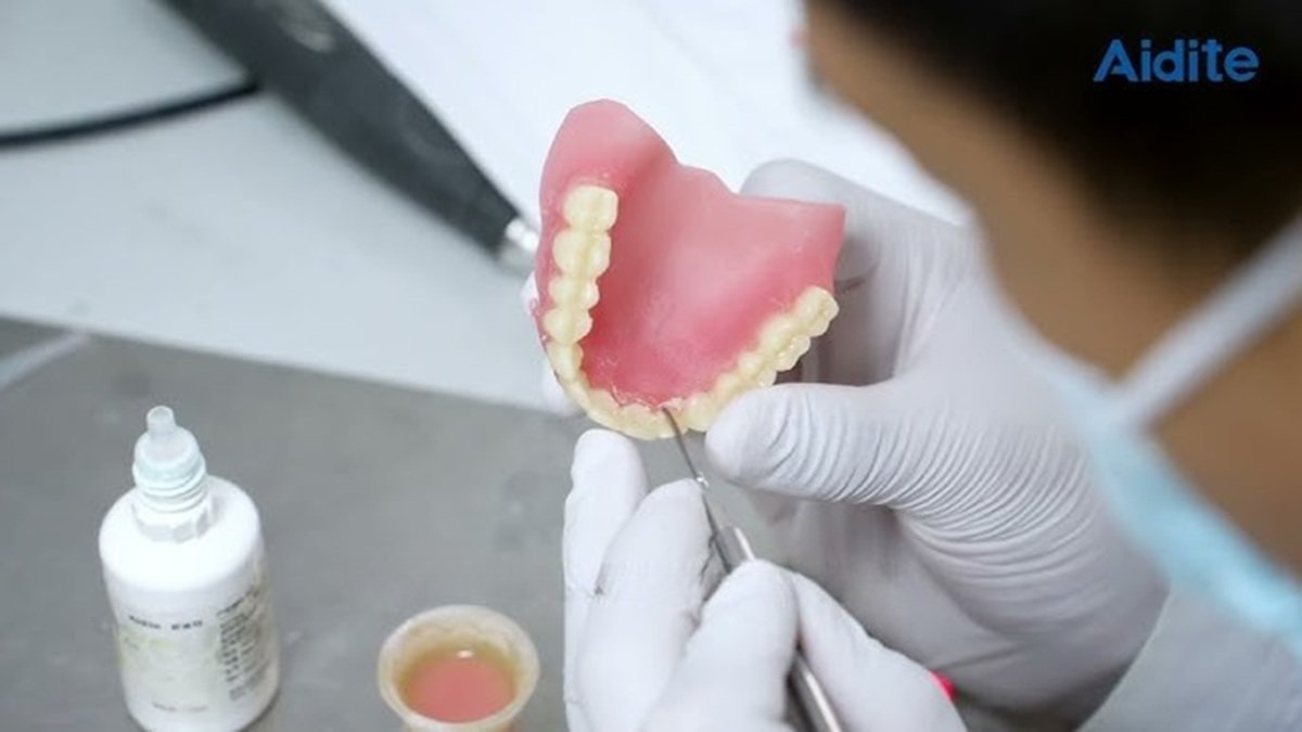 Dentist applying Dental stain