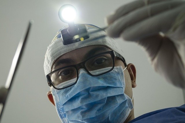 Dentist examines the patient