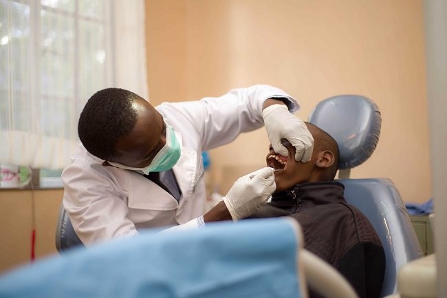Placement of dental wax on braces