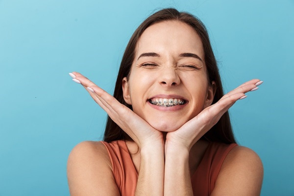Smiling adult woman showing her teeth