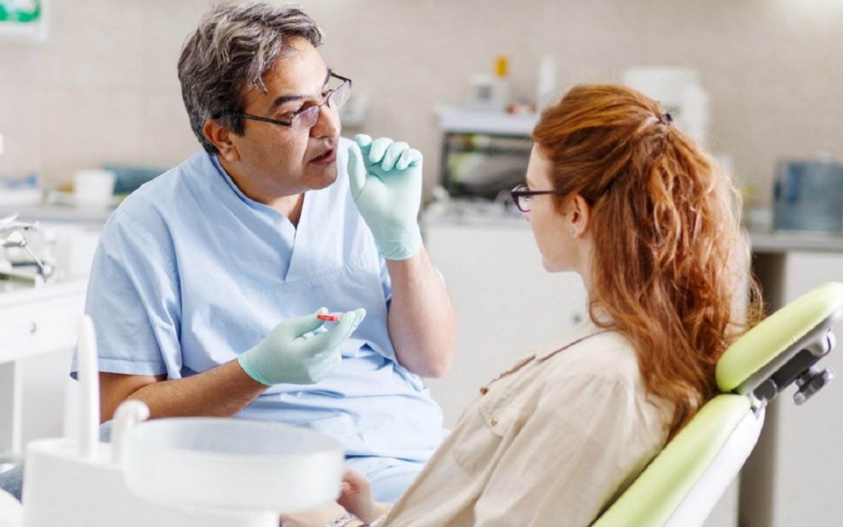 Visual of dentist consulting patient