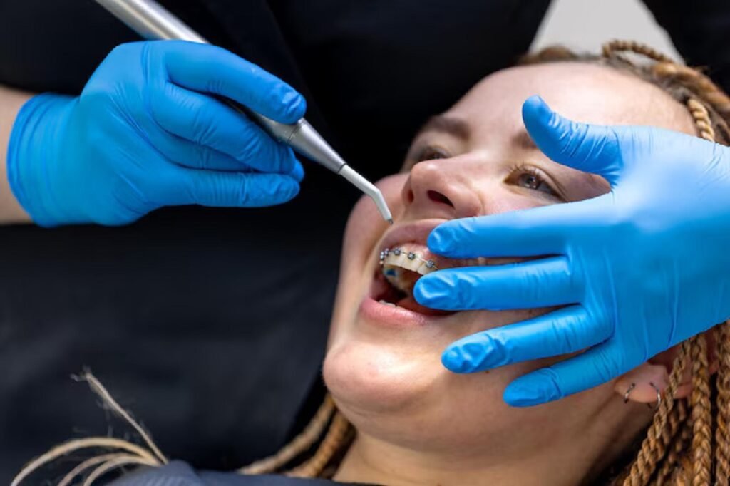 dentist examines the girl dental prosthodontic treatment