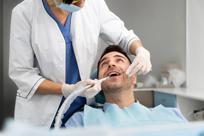 dentist trimming the edges